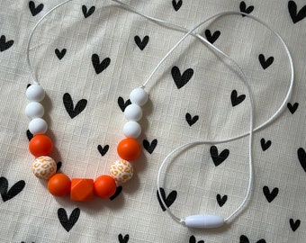 Handmade Nursing Necklace Orange and White Animal Print - White Durable Satin Cord with BPA Free Silicone Beads and Plastic Clasp