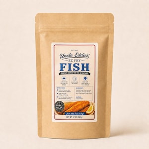 May include: A brown paper pouch of Uncle Eddie's EZ Fry Fish breading mix. The label features blue and black text, icons, instructions, ingredients, and a photo of fried fish with a lemon wedge. The package net weight is 12 oz or 340g.
