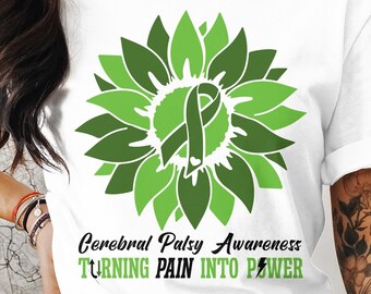 May include: White t-shirt with a green sunflower design and the text "Cerebral Palsy Awareness Turning Pain Into Power".