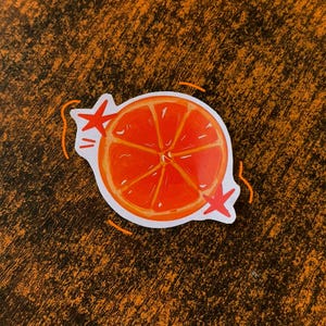 Pegatina divertida de rodaja de naranja