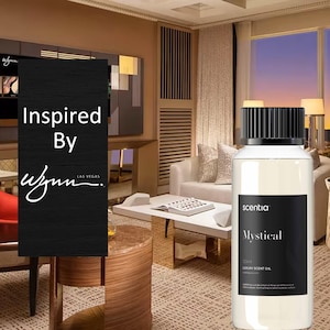 Puede incluir: Una botella de vidrio transparente con una tapa negra y una etiqueta. La etiqueta dice "sentia" y "Mystical" en texto blanco. La botella contiene un líquido transparente y está etiquetada como "100ml Luxury Scent Oil".