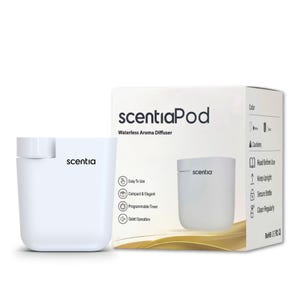 May include: A white ScentiaPod waterless aroma diffuser with a cylindrical shape and the Scentia logo printed on the front. The product is displayed next to its white packaging box, which features the product name, features, and usage instructions.