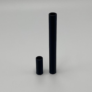 May include: Two black plastic tubes, one is longer than the other.