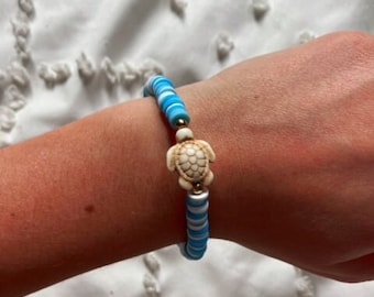 Turtle clay bead bracelet in pink, blue, and orange