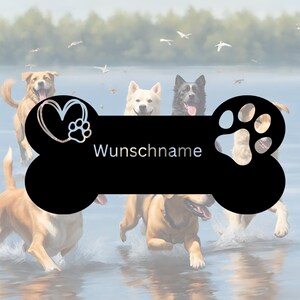 May include: A black bone-shaped dog tag with a white heart and paw print on the left side and a paw print on the right side. The tag has the text "Wunschname" in the centre. The tag is surrounded by five dogs running through water.