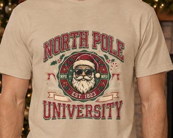 North Pole University! Fun Crewneck T-shirt with a custom graphic design with large bold lettering, Christmas Gift Idea!