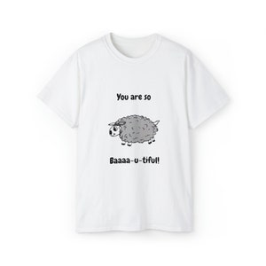May include: White t-shirt with a black and white illustration of a sheep and the text "You are so Baaaa-u-tiful!"
