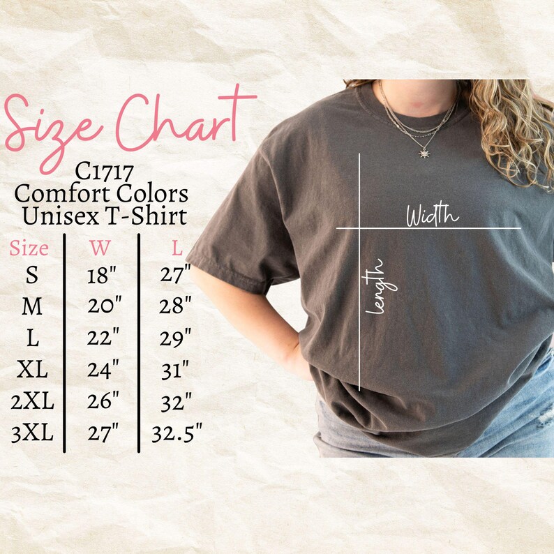 May include: A size chart for a Comfort Colors unisex t-shirt, with measurements in inches. The chart includes sizes S through 3XL, with corresponding width and length measurements. The shirt is a dark gray color.