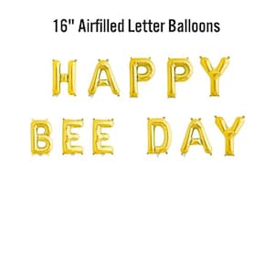 May include: Gold 16-inch air-filled letter balloons spelling "HAPPY BEE DAY" on a white background. The balloons are arranged in two rows, with "HAPPY" on top and "BEE DAY" below. Suitable for a birthday celebration.