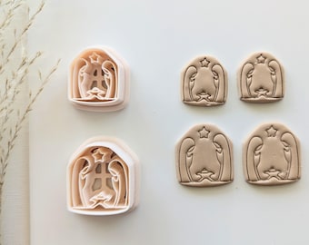 May include: Set of six cookie cutters in the shape of a nativity scene. The cutters are made of white plastic and have a detailed design.