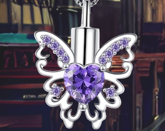 May include: Silver butterfly cremation pendant with a purple heart-shaped crystal and clear cubic zirconia accents.