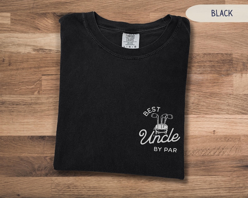 May include: Black t-shirt with a white graphic that says "Best Uncle By Par" with a golf club design.