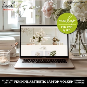 May include: A laptop mockup with a light-colored screen displaying a website design. The scene includes flowers, books, and a glass of honey. The text on the screen reads "angry Stones". The image also includes the text "PSD, PNG & JPG" and "Feminine Aesthetic Laptop Mockup".
