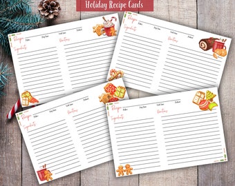 May include: Four white recipe cards with holiday-themed illustrations and the text "Holiday Recipe Cards." Each card features lines for recipe details and festive graphics like gingerbread men and wrapped gifts. The cards are arranged on a wooden surface.