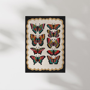 May include: A print featuring eight colorful butterfly illustrations. Each butterfly has a unique design with a variety of colors, including red, yellow, blue, and green. The butterflies are arranged on a cream-colored background with a black border.