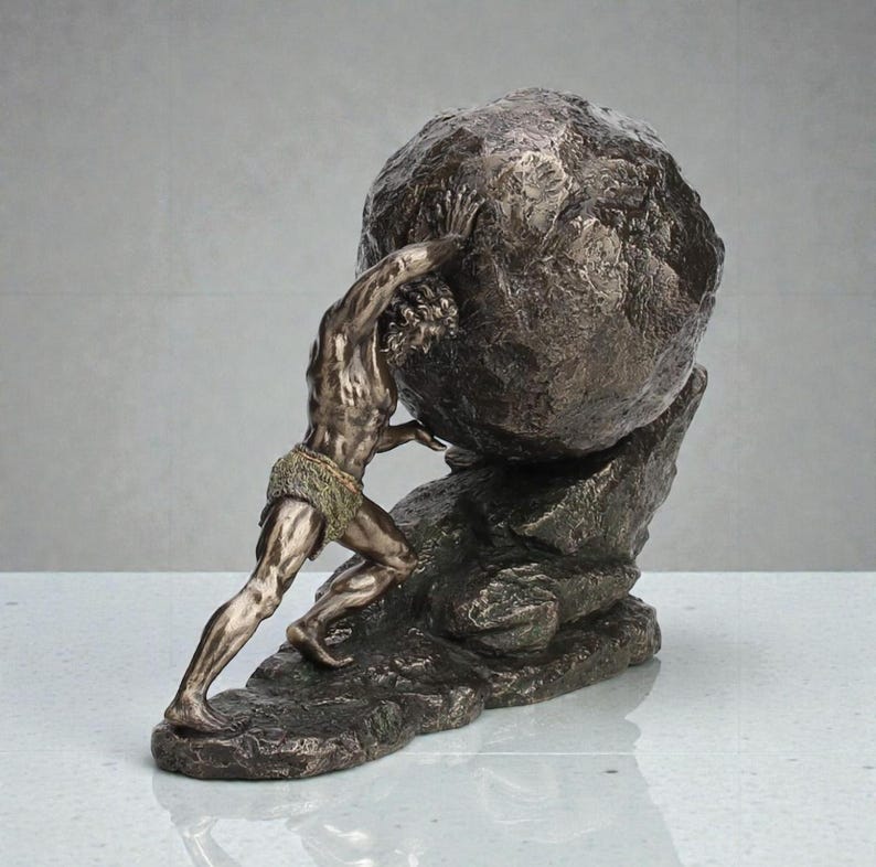 May include: Bronze sculpture depicting a muscular figure pushing a large, textured boulder uphill. The figure is wearing a loincloth. The sculpture is on a rocky base, with a metallic bronze finish. A classical art piece.