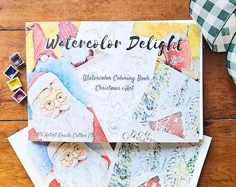 May include: A watercolor coloring book with a Christmas theme. The cover features a Santa Claus illustration and the title "Watercolor Delight". The book is made with 100% artist grade cotton paper.
