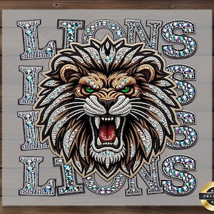May include: A detailed illustration of a lion's head with an open mouth, green eyes, and a jeweled mane. The word "LIONS" is displayed multiple times in a jeweled font. The image has a premium quality seal.
