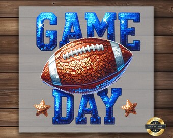 May include: A blue and orange sequined football with the words "GAME DAY" in blue sequins. The football is on a gray background.