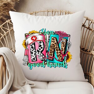 May include: White throw pillow with a colorful graphic design featuring the letters "RN" with a stethoscope, a syringe, a sunflower, and the text "You good hands".