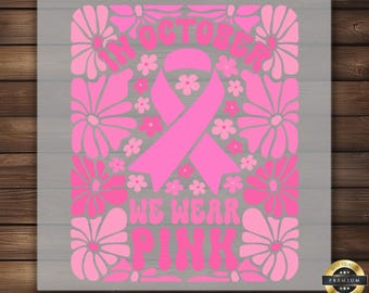 May include: Pink floral design with a pink ribbon in the center and the text "In October We Wear Pink".
