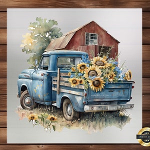 May include: A blue vintage pickup truck with a wooden bed filled with sunflowers and other wildflowers. The truck is parked in front of a red barn with a white door.
