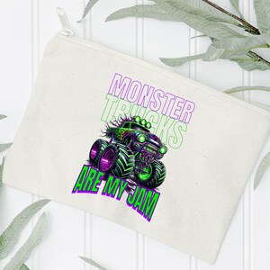 May include: A white canvas zippered pouch with a green and purple monster truck graphic and the text "Monster Trucks Are My Jam".