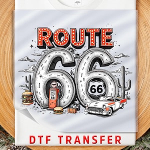 May include: A Route 66 DTF transfer design featuring the words "ROUTE 66" in red marquee letters. The design includes a road, a classic car, a gas pump, cacti, and a burger. The number 66 is prominently displayed.
