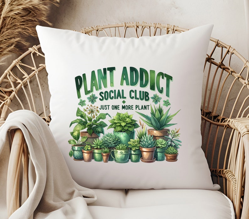 May include: White cushion with a green and brown illustration of potted plants and the text "Plant Addict Social Club Just One More Plant".