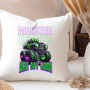 May include: White cushion with a green and purple monster truck graphic and the text "Monster Trucks Are My Jam".