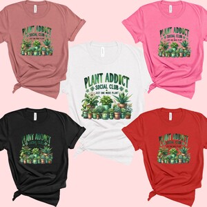 May include: Five t-shirts in different colours with a graphic print of a variety of potted plants and the text "Plant Addict Social Club Just One More Plant".