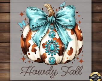 May include: A decorative pumpkin with a turquoise bow and jewelry, brown and white cowhide pattern, and the text "Howdy Fall." Two blue butterflies and starburst accents complete the design. The image is on a gray wooden background.