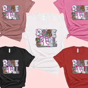 May include: Five different color t-shirts with the word "BASEBALL" in a colorful, patterned design. The shirts are in pink, white, black, red, and brown.