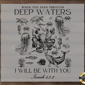 May include: A gray wooden sign featuring a detailed black and white illustration of various sea creatures, including an octopus, jellyfish, and whale. The text reads "WHEN YOU PASS THROUGH DEEP WATERS, I WILL BE WITH YOU, Isaiah 43:2."