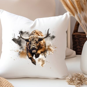 May include: A white throw pillow with a brown and white bull charging through a cloud of brown and gray watercolor paint splatters.