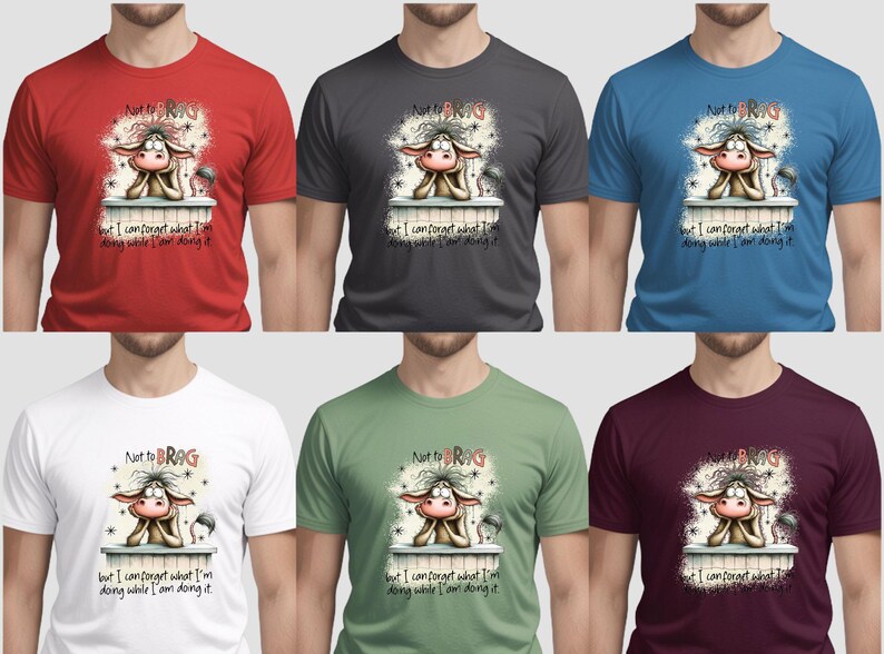 May include: A collection of six t-shirts in various colors: red, charcoal, blue, white, green, and burgundy. Each shirt features a cartoon cow graphic with the text "Not to BRAG" and "but I can forget what I'm doing while I am doing it."