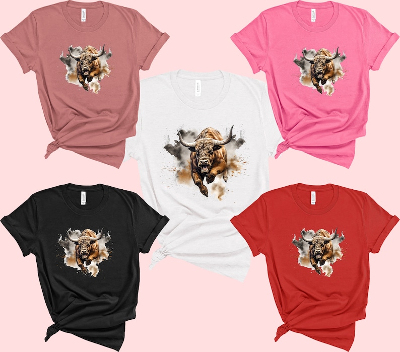 May include: Five different color t-shirts with a brown bull graphic on each. The bull is running and has a watercolor effect around it. The t-shirts are in the colors pink, white, black, red, and brown.