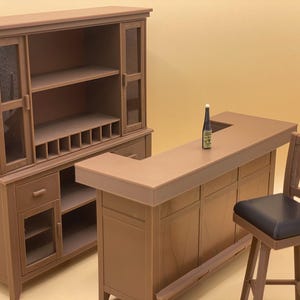 May include: A brown wooden bar cabinet with a glass door and shelves. The cabinet has a built-in bar counter with a bottle of wine on top. A brown wooden bar stool with a black seat is next to the counter.