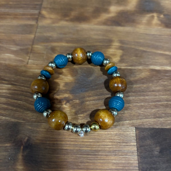 Blue, silver, and brown bracelet with brown wooden beads