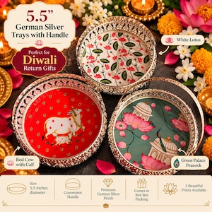 May include: Three 5.5-inch diameter round German silver trays with handles. One tray features a white lotus pattern, one displays a red cow with a calf, and one shows a green palace with a peacock and pink lotus flowers.
