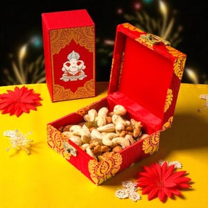 May include: A red box with gold decorative accents and a hinged lid, filled with mixed nuts. A smaller matching box is visible in the background. The boxes are on a yellow surface, with red flower decorations.