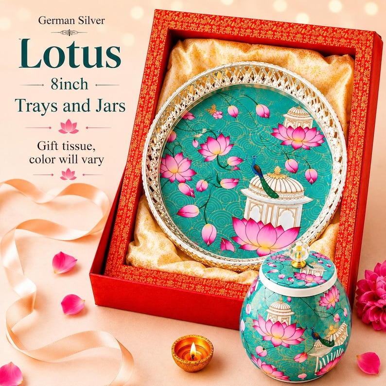 May include: A German Silver 8inch Lotus tray and jar set in a red gift box. The tray features a teal background with pink lotus flowers, a white pavilion, and a peacock. The matching jar has a lid with a clear knob and similar floral motifs.