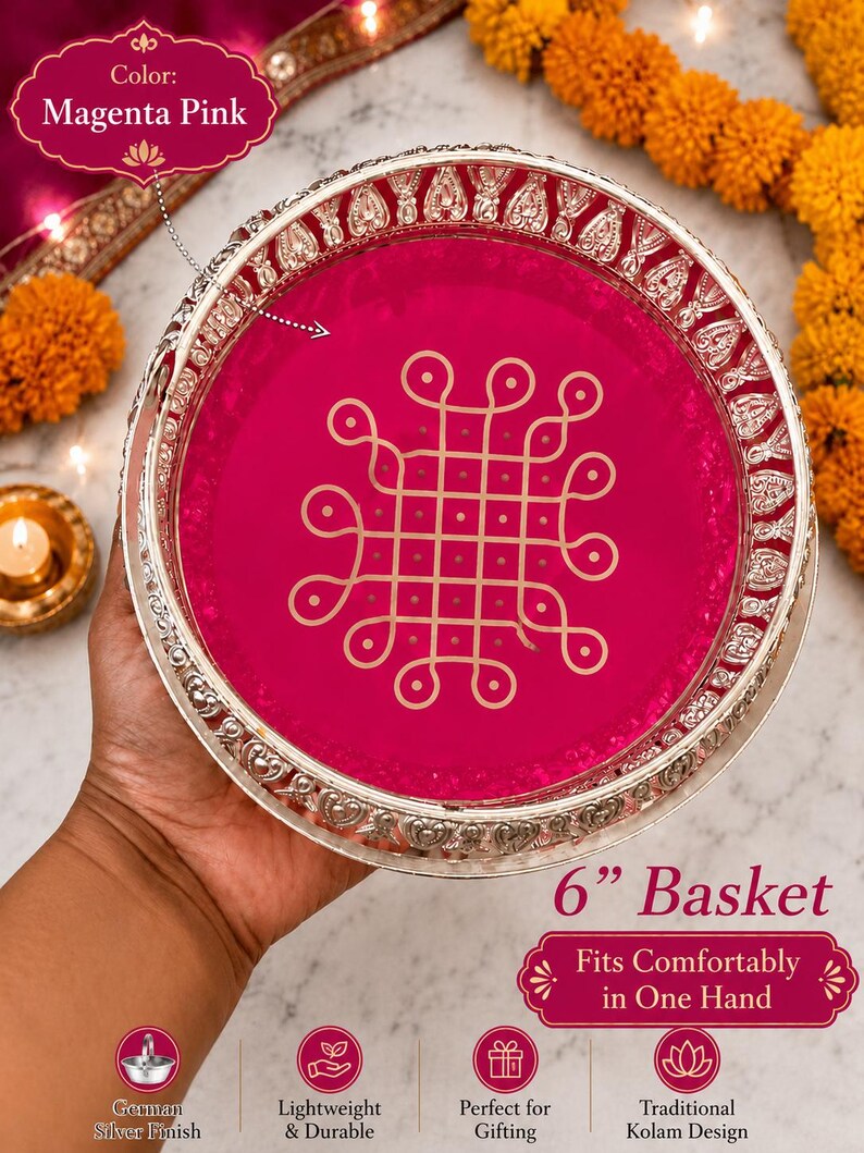 May include: A round magenta pink basket with a silver-toned rim featuring an embossed pattern. The center of the basket displays a gold-colored geometric Kolam design. The text on the image includes Color: Magenta Pink, 6" Basket, and Fits Comfortably in One Hand.