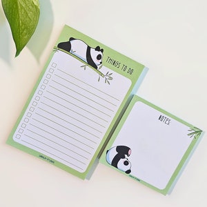 May include: Two panda-themed notepads. One notepad is rectangular with lined paper and the words "THINGS TO DO" at the top. The other notepad is square with the word "NOTES". Both have a green border and a panda illustration.