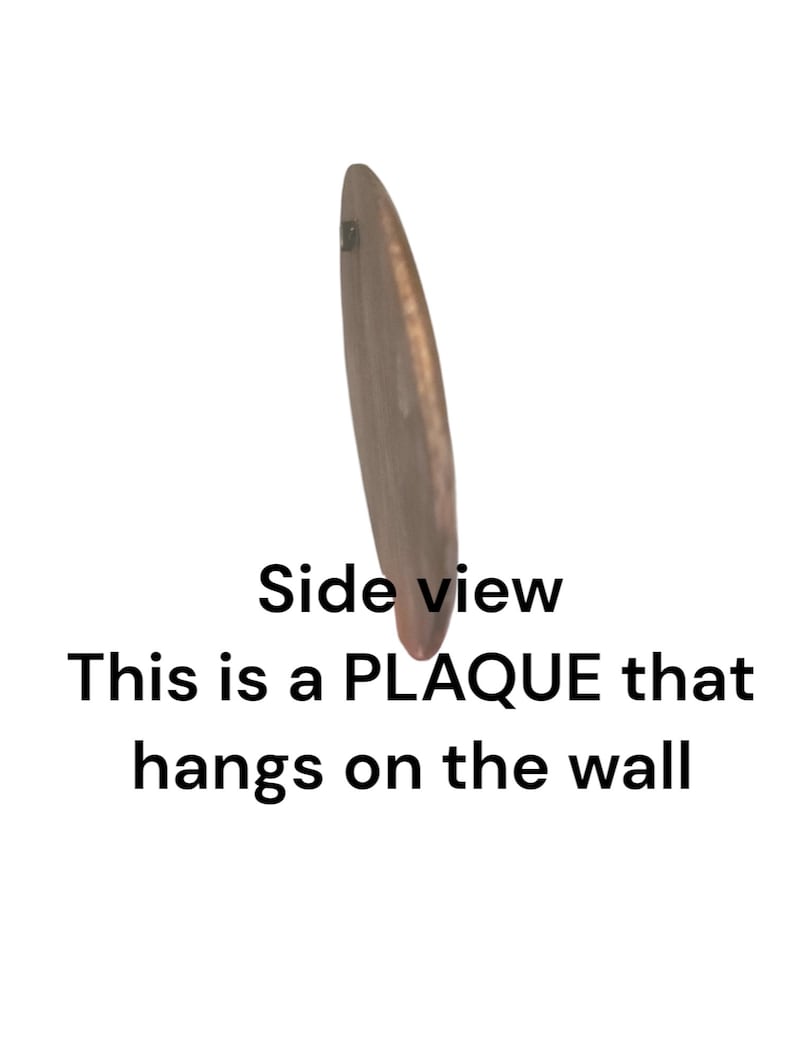 May include: Side view of a wooden plaque that hangs on the wall.  This is a PLAQUE that hangs on the wall.