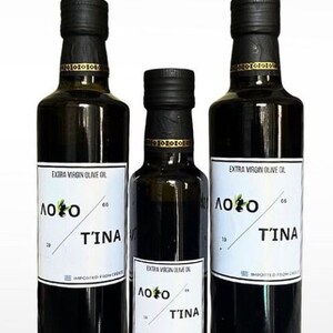 May include: Three glass bottles of extra virgin olive oil with black labels. The labels have white text that reads "ΛΟΙΟ 66 ΤΊΝΑ 19" and "IMPORTED FROM GREECE".