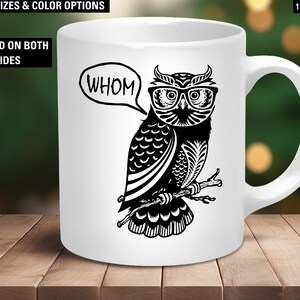 May include: White ceramic mug featuring a black and white illustration of an owl wearing glasses and a speech bubble that says "whom".