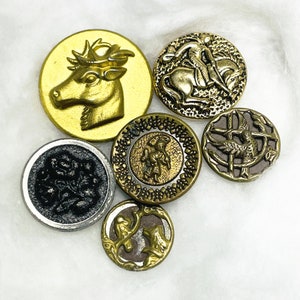 six (6) self-shank pictorial buttons