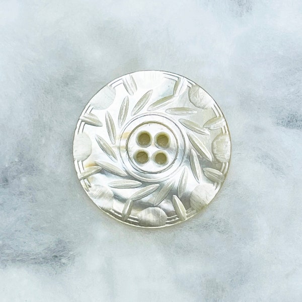 a pretty leaf-carved mother-of-pearl button