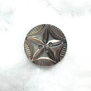 a super smoky carved mother-of-pearl button